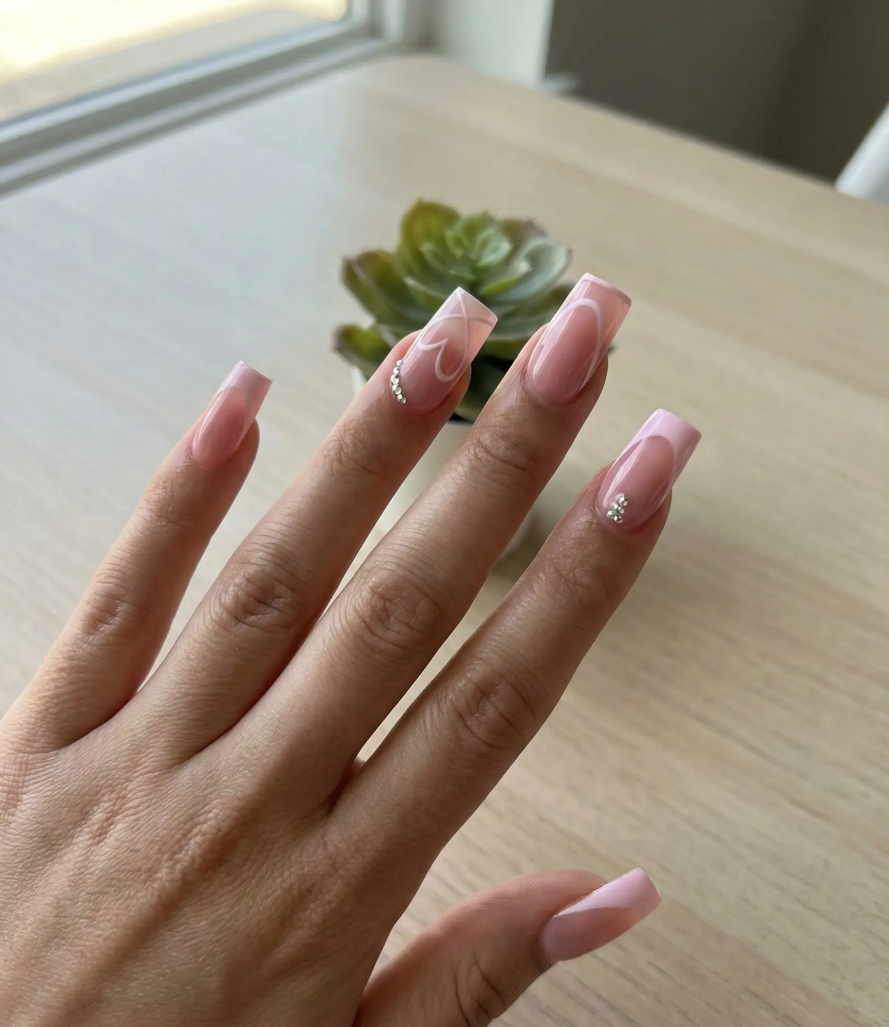 Fresh Pink French Tip Square Nails With White Heart Outline And Rhinestones